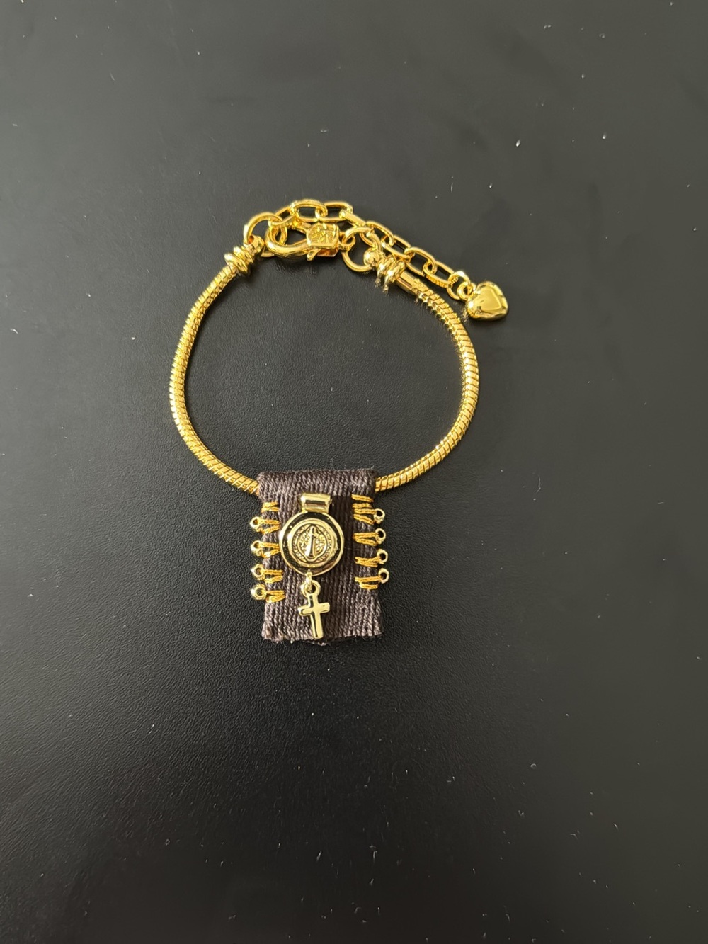 Gold Tone Religious Charm Bracelet with Brown Fabric Accent